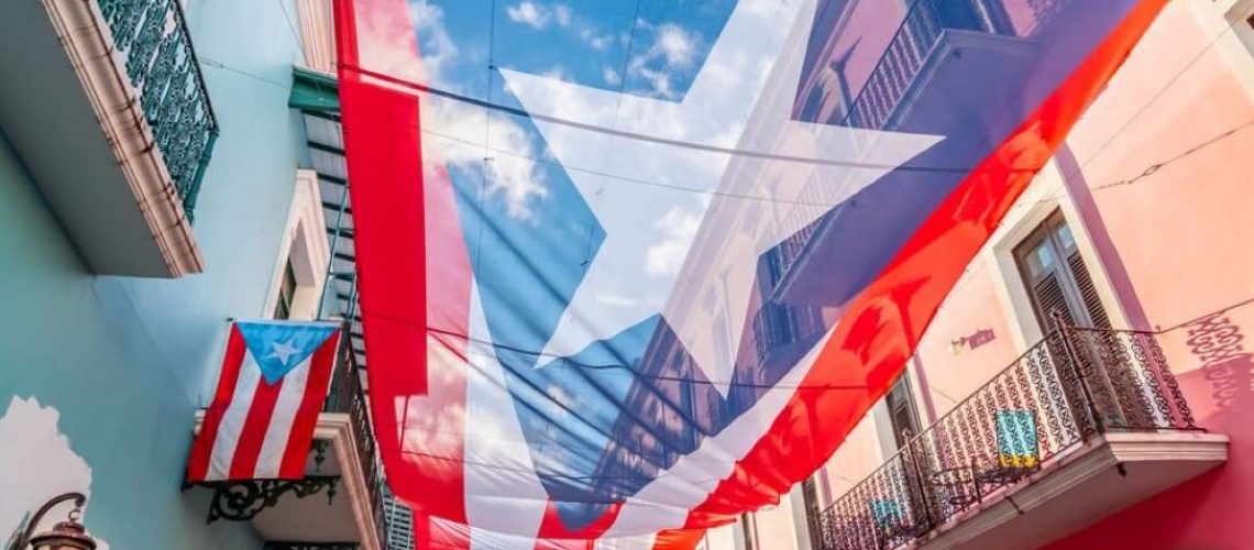 city-centre-of-San-Juan-with-large-Puerto-Rican-flag-above-the-street